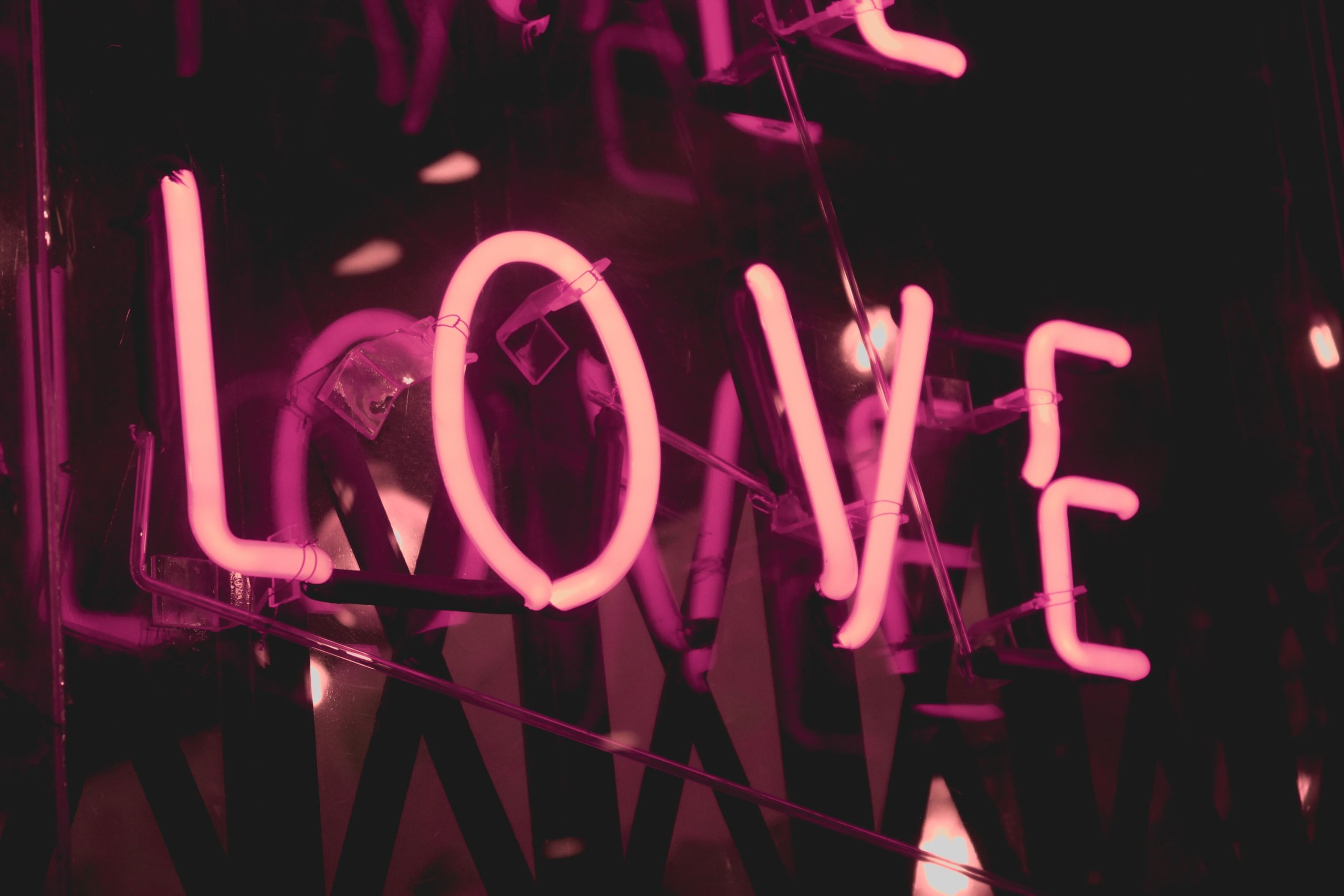 The word Love in neon letters